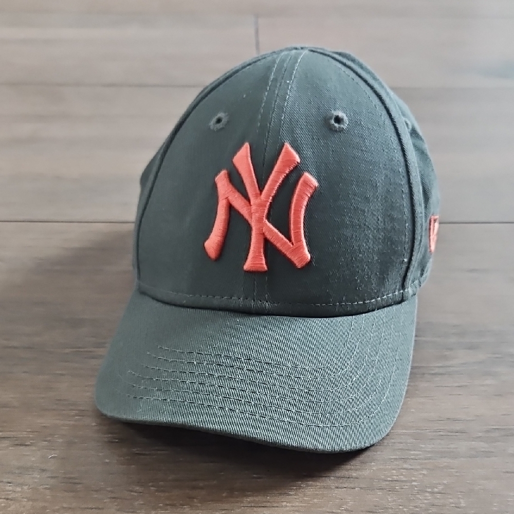 Genuine Merchandise Dark Green Cap with Bold Orange Emblem